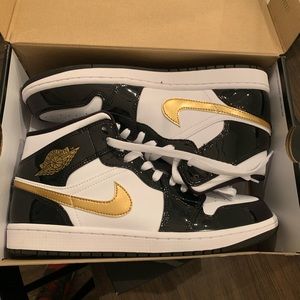 Nike air jordan mid black and gold